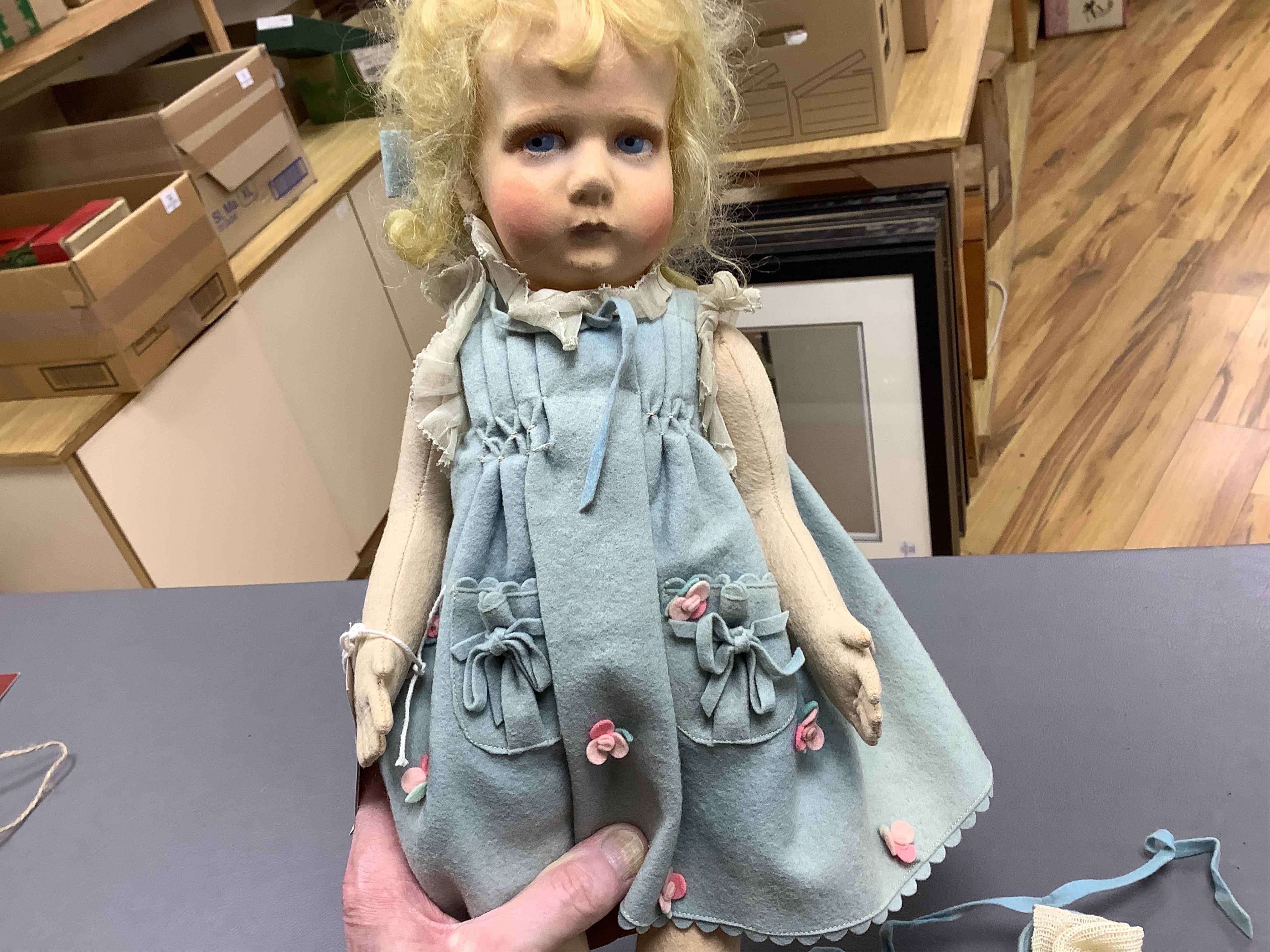 A wool felt Lenci doll with painted features to the face, 42cm long
